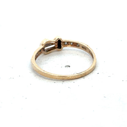 9ct yellow gold buckle ring size M 1/2 with a polished finish, featuring a distinctive buckle design by Reeves and Sons.