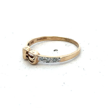 9ct yellow gold buckle ring in size M 1/2 with a polished finish, featuring a distinctive buckle design by Reeves and Sons.