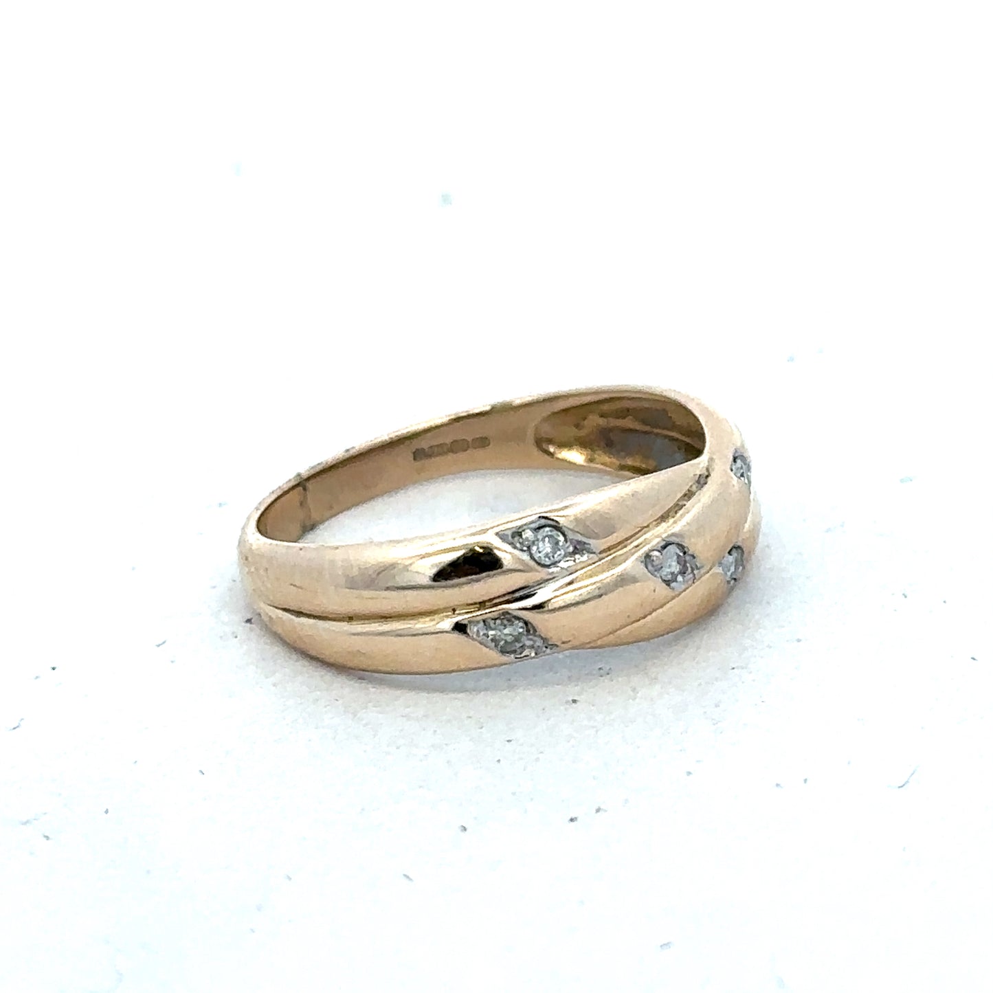 9ct yellow gold diamond ring in size P with sparkling diamonds, crafted by Reeves and Sons, displayed on a neutral background.
