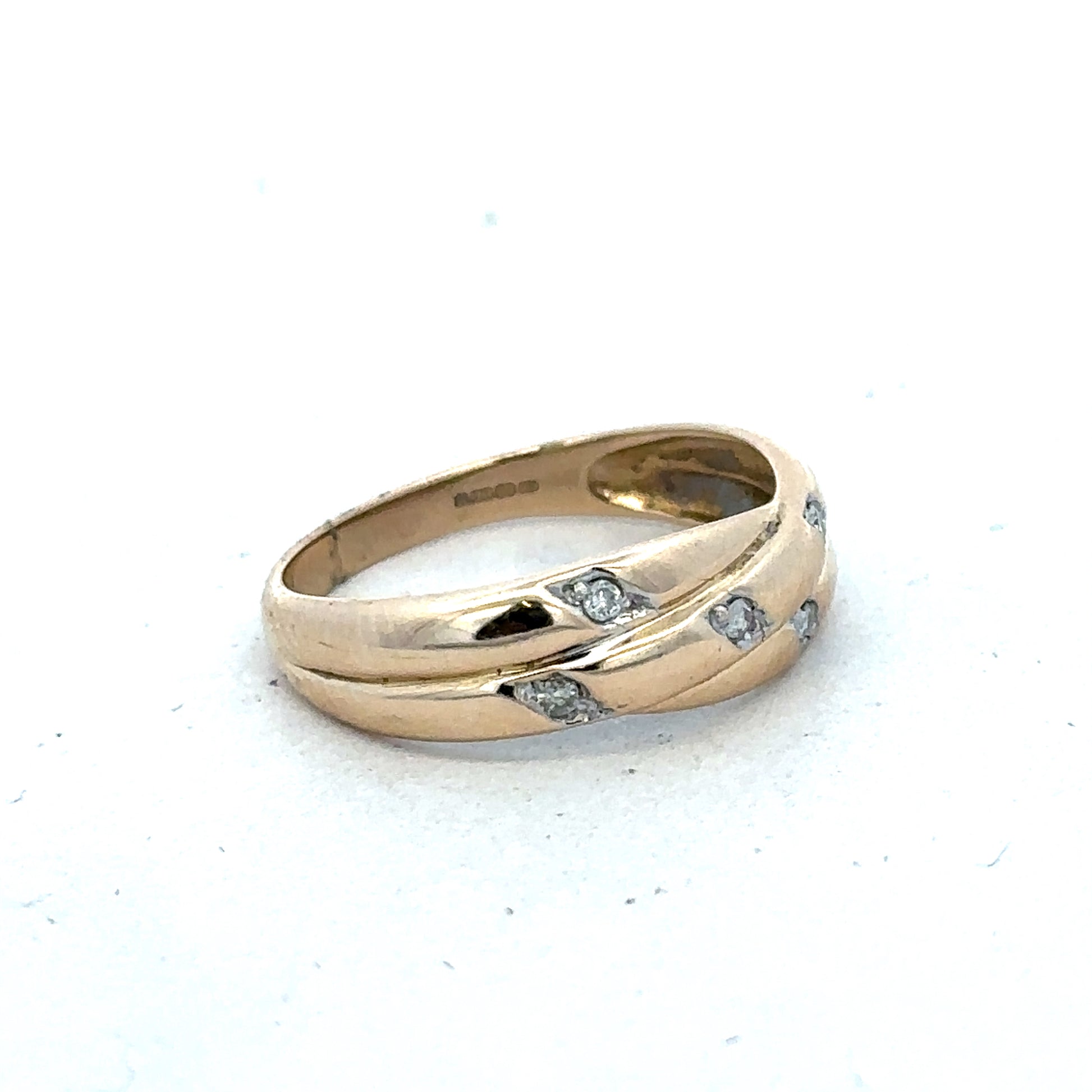 9ct yellow gold diamond ring in size P with sparkling diamonds, crafted by Reeves and Sons, displayed on a neutral background.