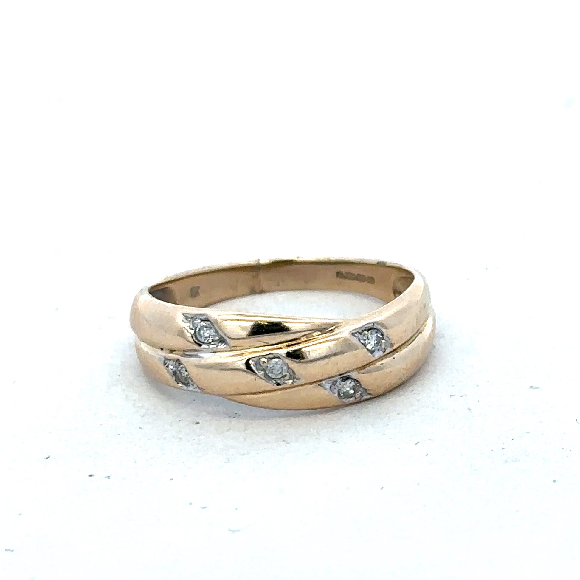 9ct yellow gold diamond ring with intricate design, size P, crafted by Reeves and Sons, featuring sparkling diamonds on a polished band.
