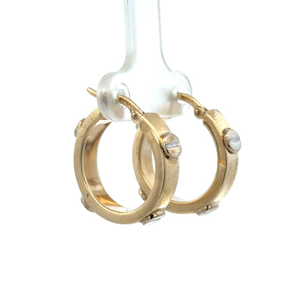 9ct yellow gold hoop earrings weighing 2.9g, crafted by Reeves and Sons, shown in a close-up image highlighting their classic design.