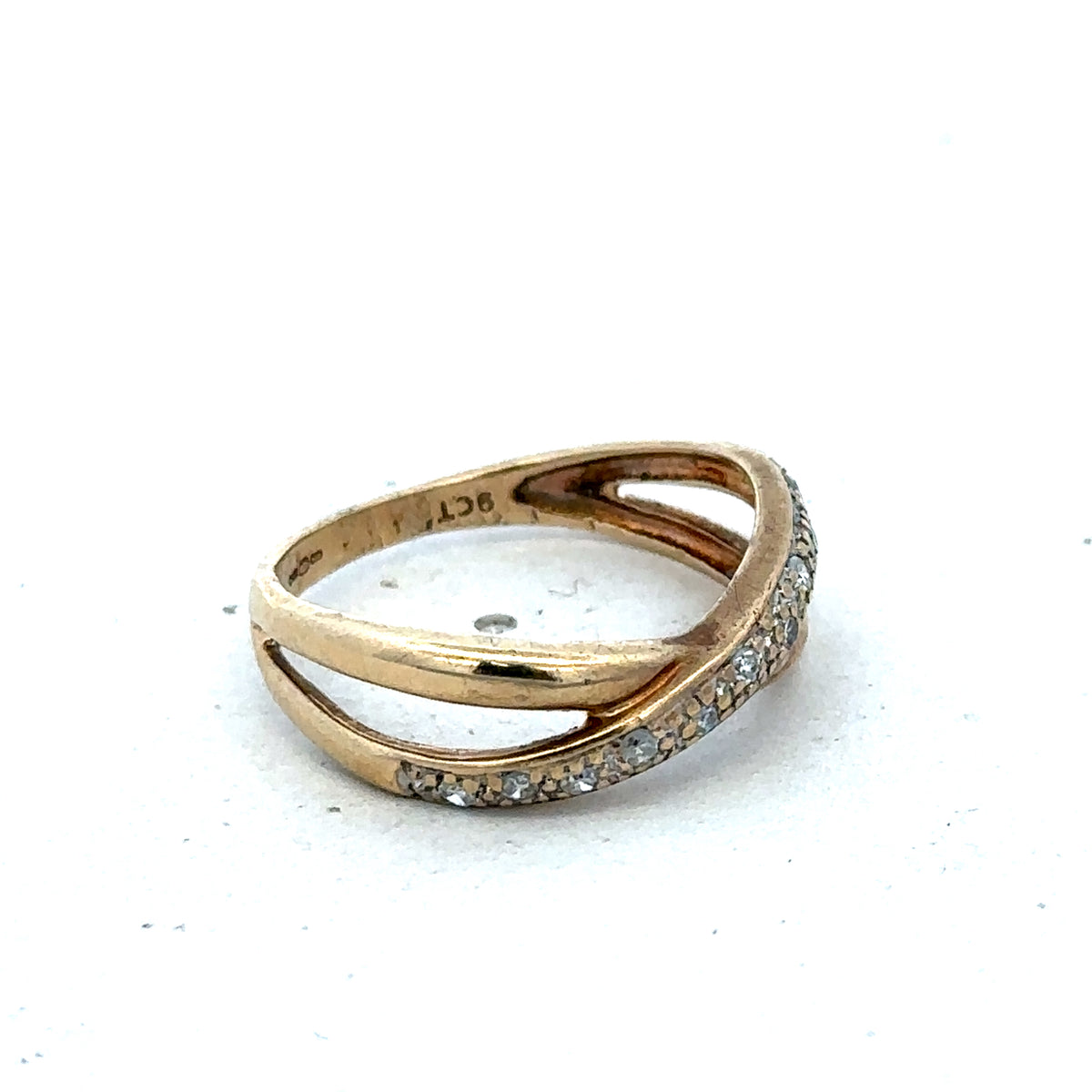 9ct yellow gold ring in size N with a smooth band, crafted by Reeves and Sons.