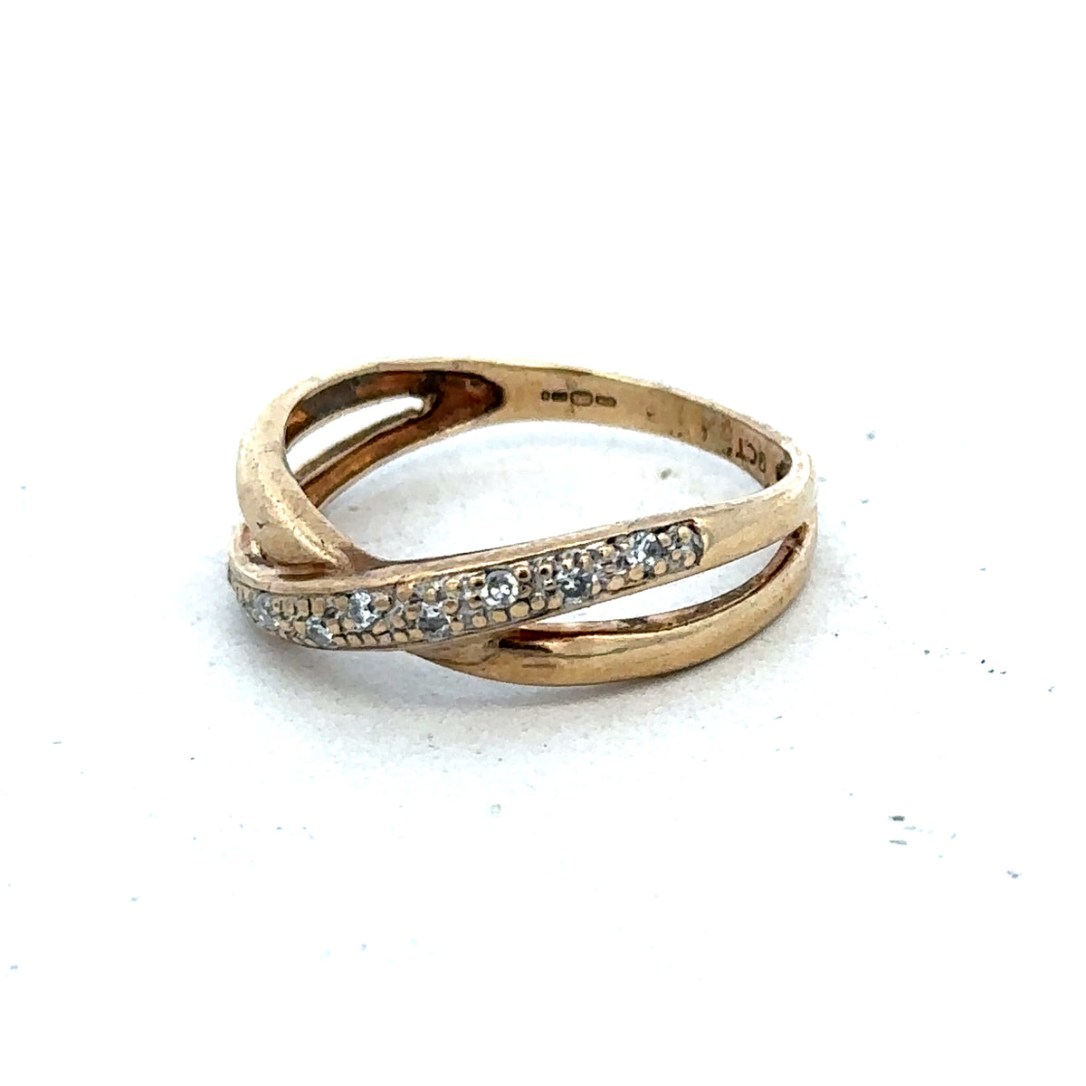 9ct yellow gold ring in size N with a smooth band, crafted by Reeves and Sons, displayed on a neutral background.
