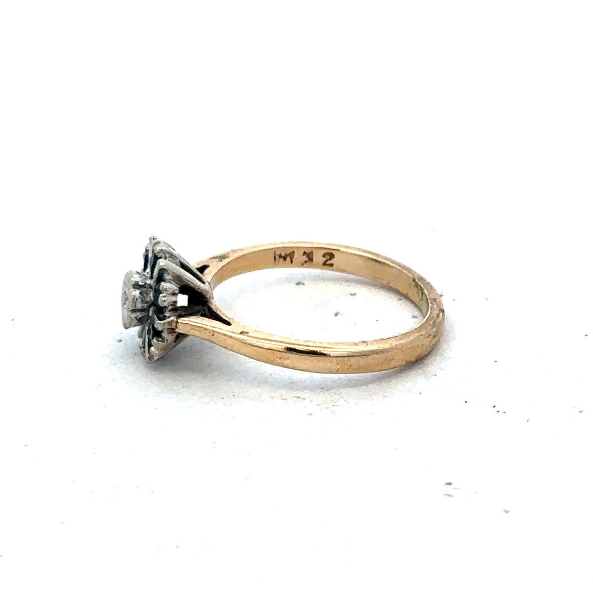 9ct yellow gold ring size J by Reeves and Sons, showcasing a smooth polished band with subtle shine.