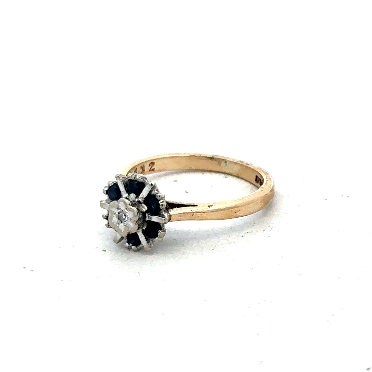 9ct yellow gold ring in size J by Reeves and Sons, featuring a smooth polished band.
