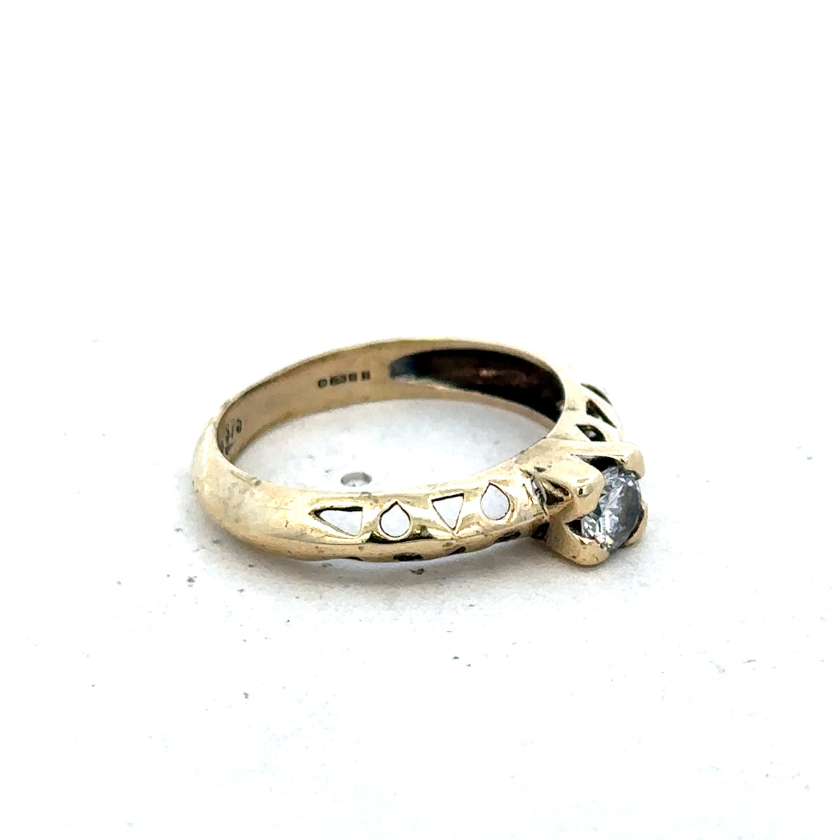 9ct yellow gold ring in size M with a smooth band, crafted by Reeves and Sons.