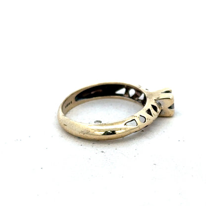 9ct yellow gold ring size M by Reeves and Sons, showcasing a smooth, polished band with a subtle shine.