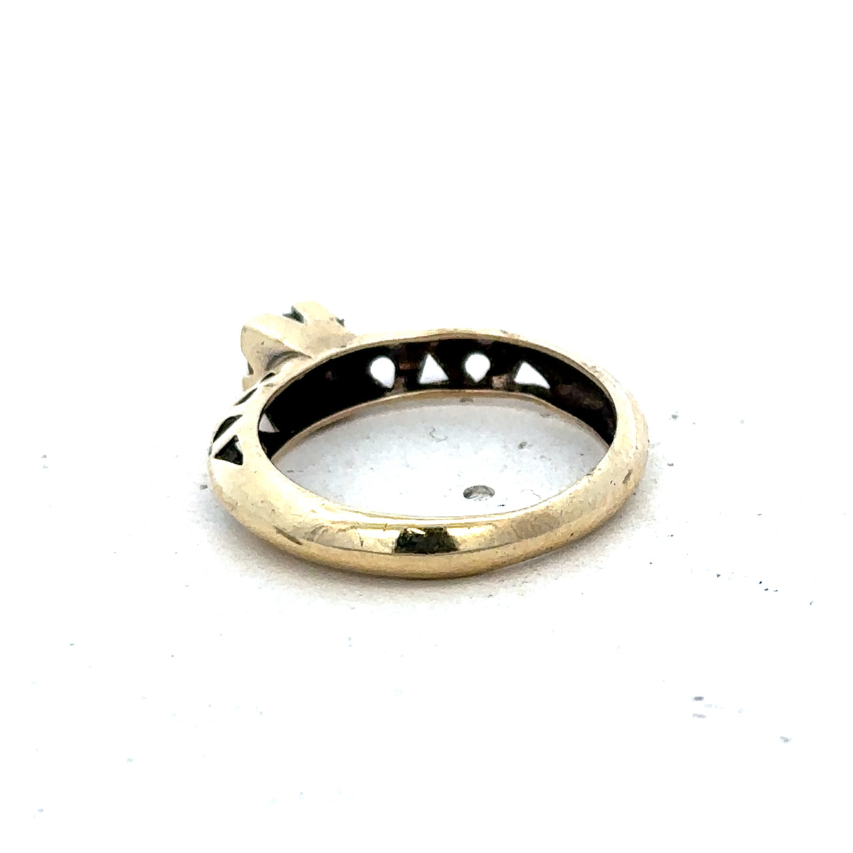 9ct yellow gold ring in size M with a smooth polished band, designed by Reeves and Sons.