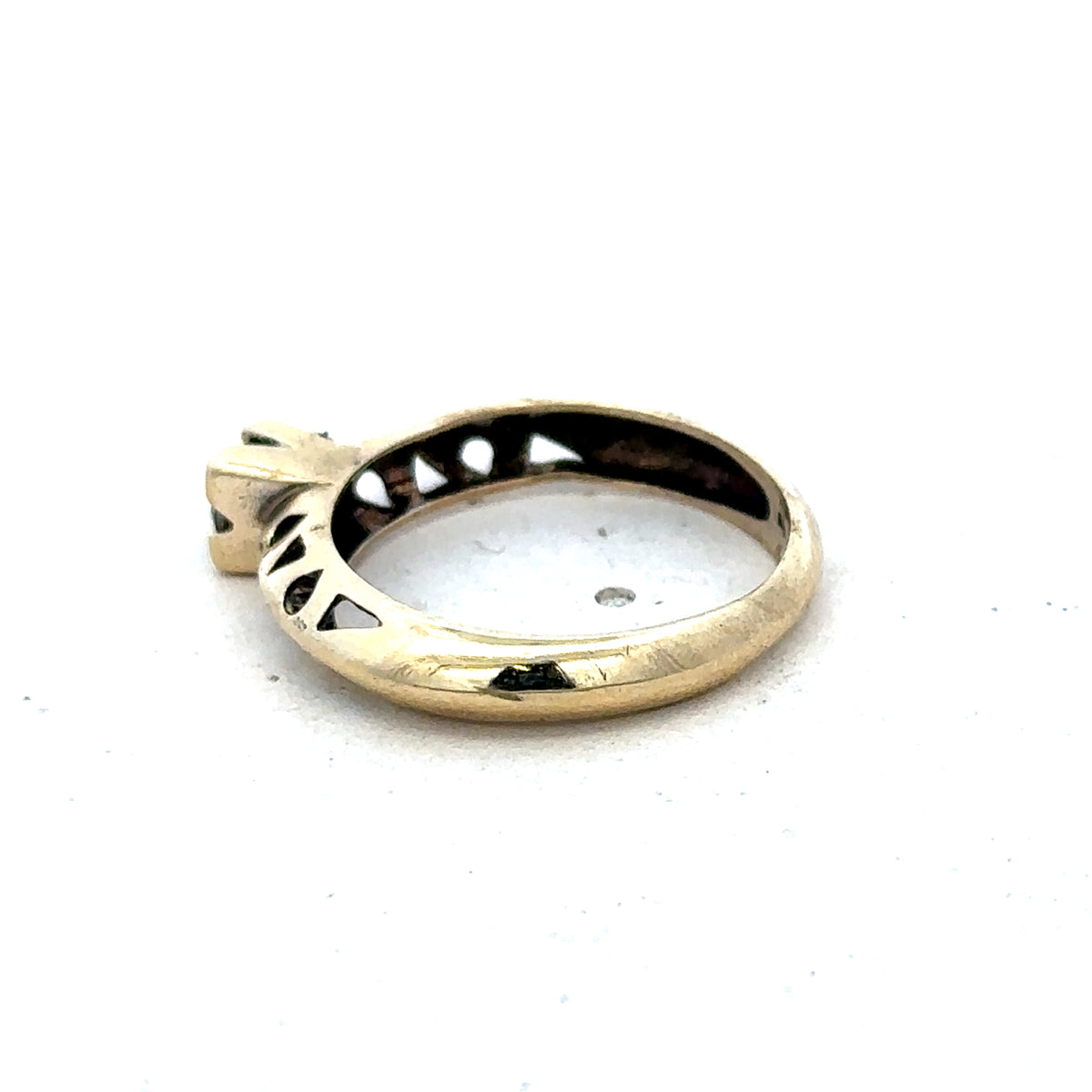 9ct yellow gold ring in size M by Reeves and Sons, featuring a polished band and classic design.