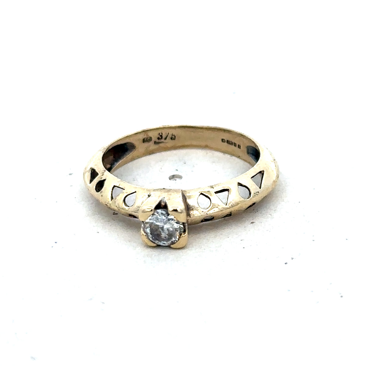 9ct yellow gold ring in size M with a smooth band, crafted by Reeves and Sons, displayed on a plain background.