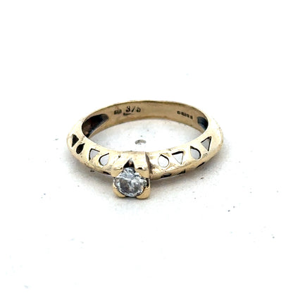 9ct yellow gold ring in size M with a smooth band, crafted by Reeves and Sons, displayed on a plain background.