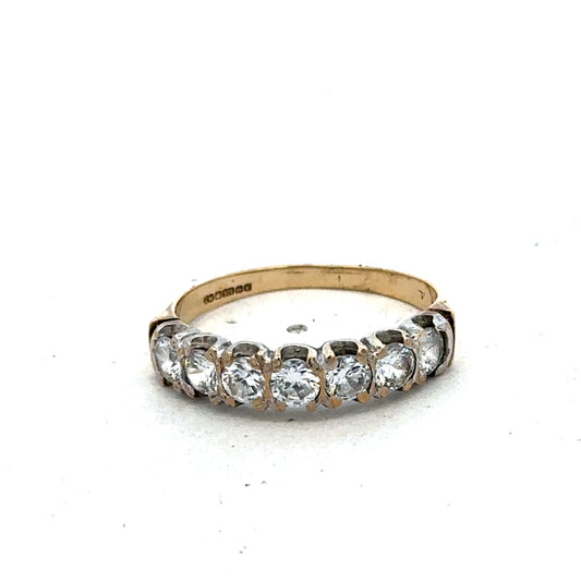 9ct yellow gold ring in size Q by Reeves and Sons, featuring a smooth band and polished finish.