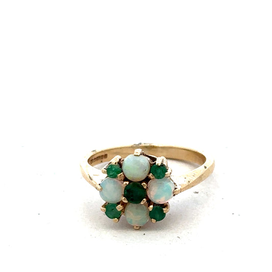 9ct yellow gold ring in size M with a simple band design, crafted by Reeves and Sons, shown on a plain background.