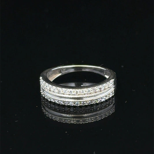 9ct white gold diamond ring by Reeves and Sons, featuring sparkling diamonds and a sleek band design.