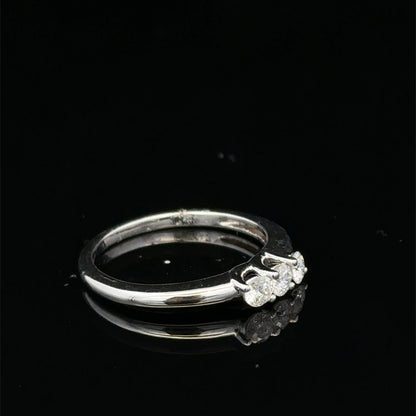 18ct white gold diamond ring by Reeves and Sons featuring sparkling diamonds set in an elegant design.