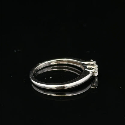 18ct white gold diamond ring by Reeves and Sons featuring a sparkling diamond set in an elegant band.