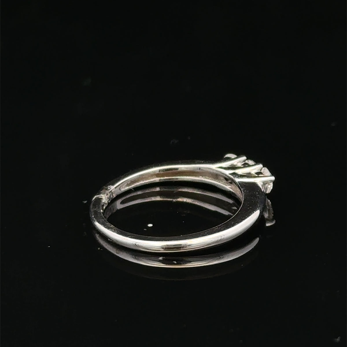 18ct white gold diamond ring by Reeves and Sons featuring a sparkling diamond set in a sleek band.