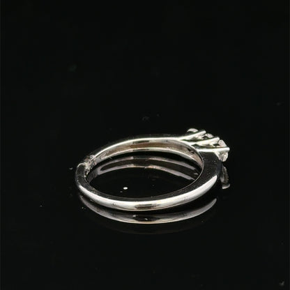 18ct white gold diamond ring by Reeves and Sons featuring a sparkling diamond set in a sleek band.