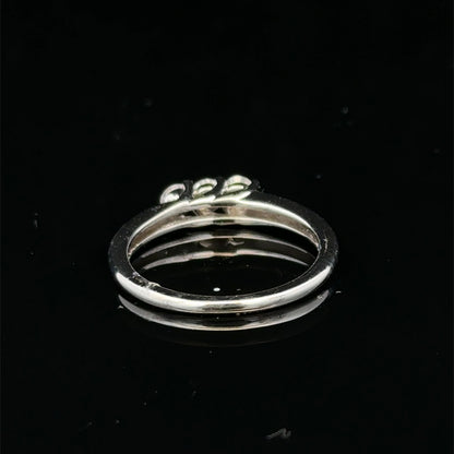 18ct white gold diamond ring by Reeves and Sons featuring a sparkling diamond setting and elegant design.