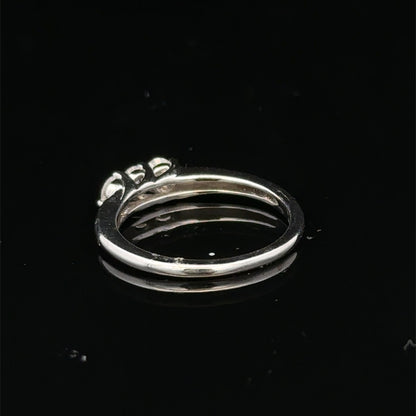 18ct white gold diamond ring by Reeves and Sons with sparkling diamonds and intricate design, photographed against a neutral background.