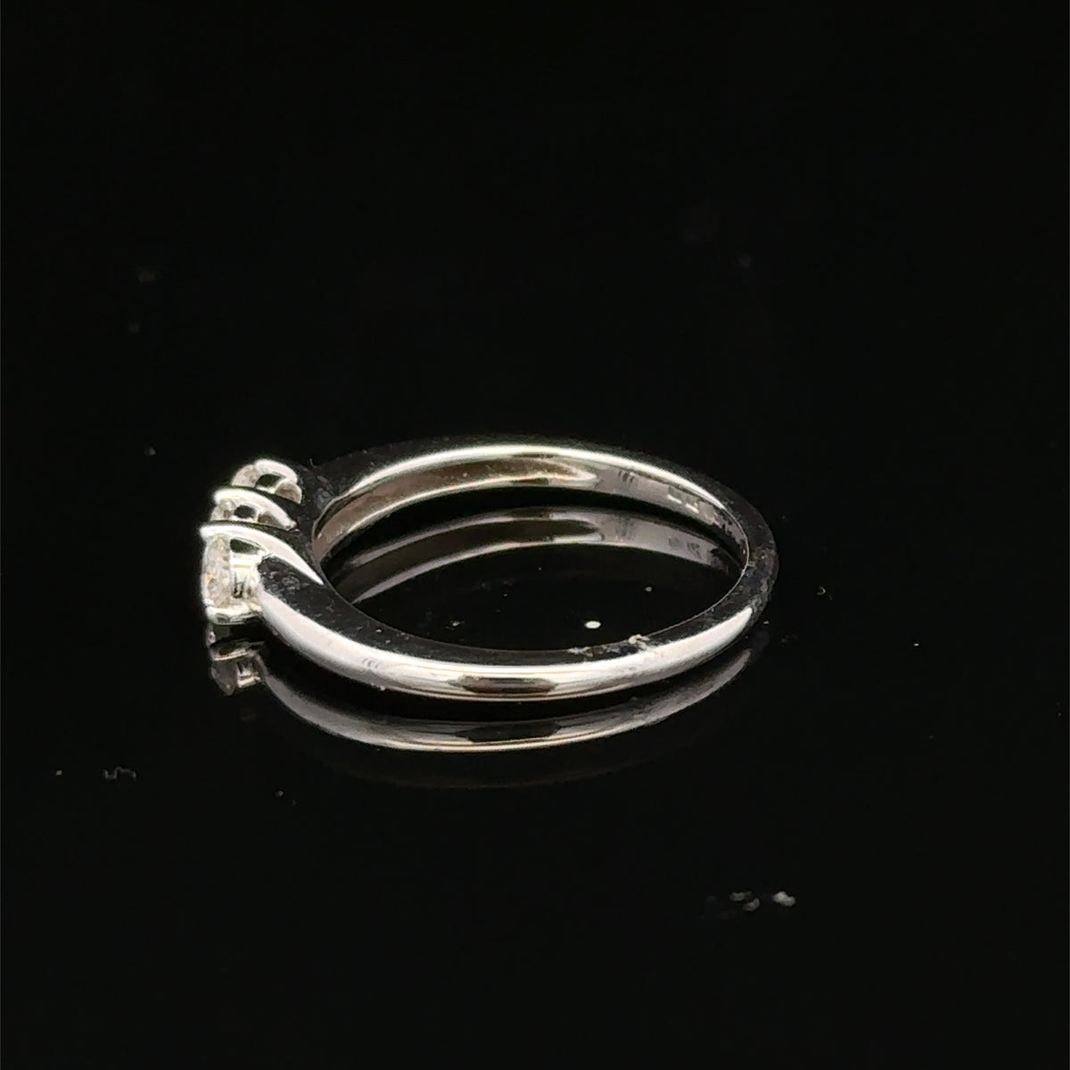 18ct white gold diamond ring by Reeves and Sons featuring sparkling diamonds and elegant design.