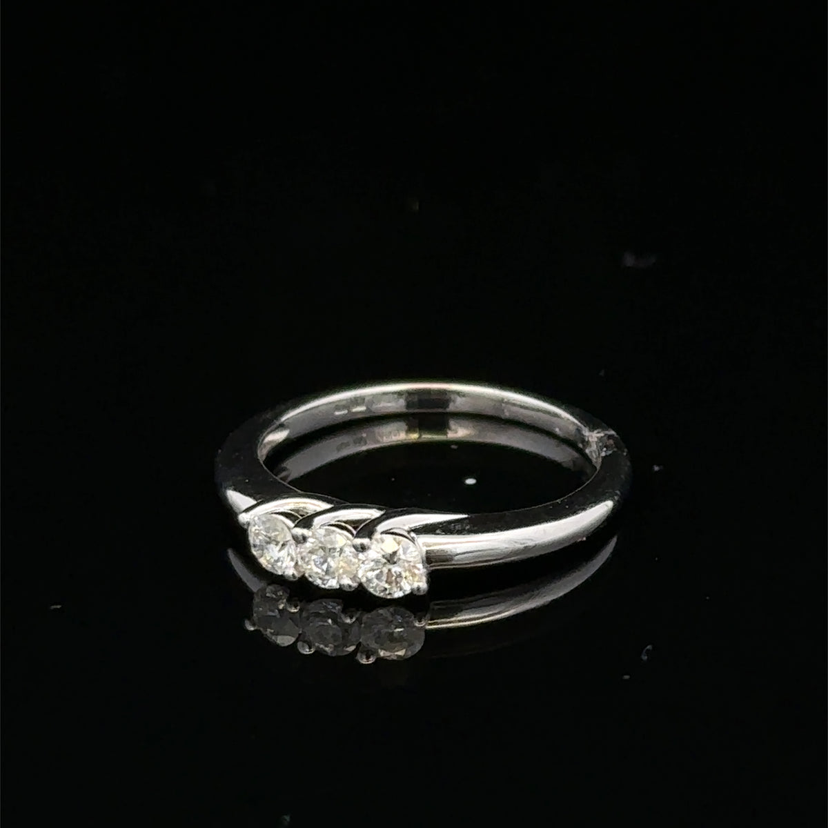 18ct white gold diamond ring by Reeves and Sons featuring sparkling diamonds set in a elegant band.