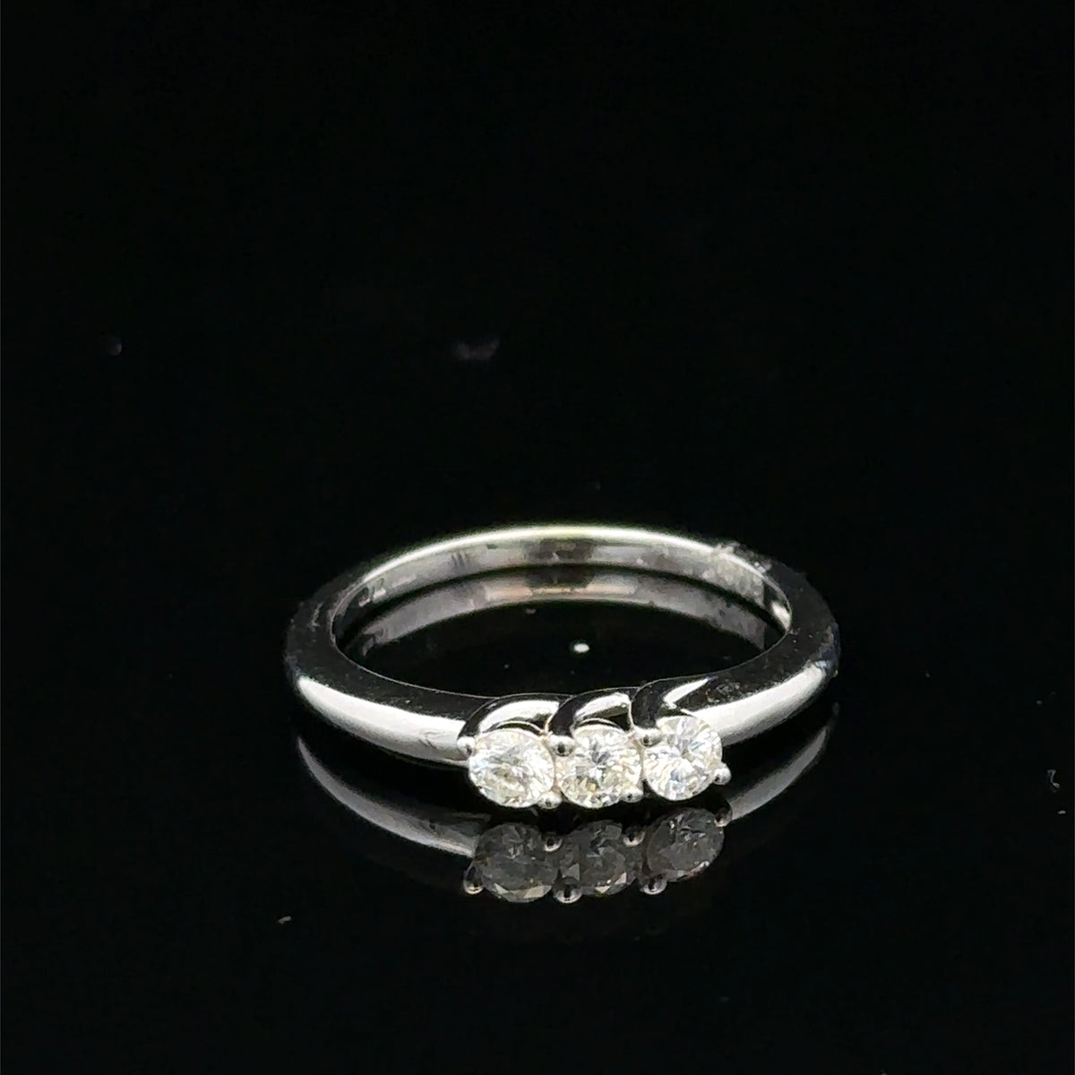18ct white gold diamond ring by Reeves and Sons with sparkling diamonds and elegant design.