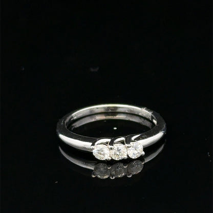 18ct white gold diamond ring by Reeves and Sons with sparkling diamonds and elegant design.