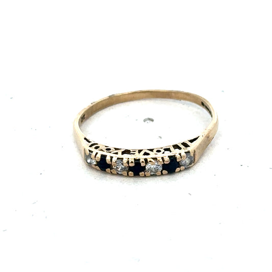 9ct yellow gold ring size Q by Reeves and Sons, close-up view showing smooth band and polished finish.