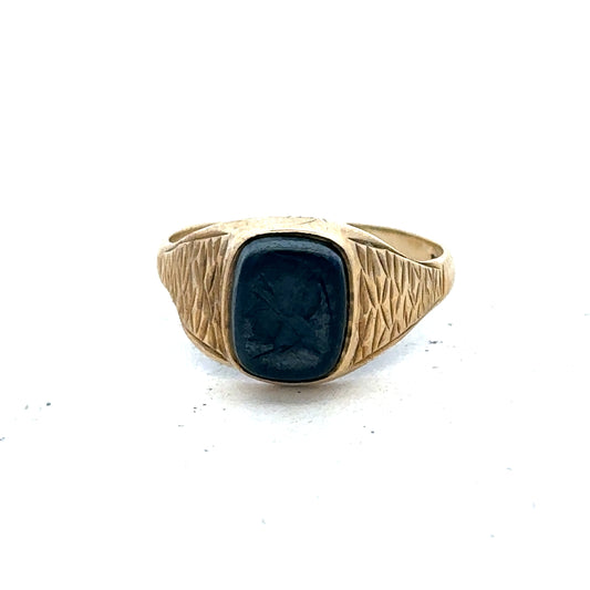 Reeves and Sons 9ct yellow gold signet ring size S with polished finish and classic design, displayed on a neutral background.