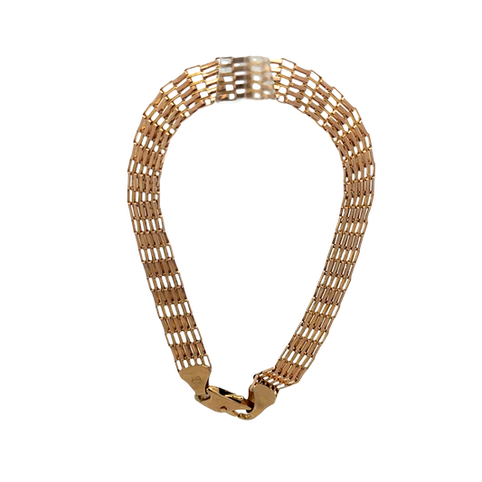 9ct yellow gold bracelet by Reeves and Sons, 6.4g, featuring a sleek and polished design with intricate links.