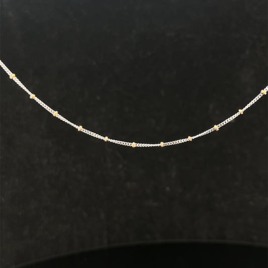 9ct white gold chain weighing 2.7g, featuring a delicate link design, from Reeves and Sons.