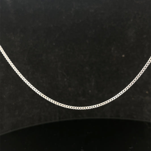 9ct white gold chain weighing 4.1g, featuring a delicate link design from Reeves and Sons.
