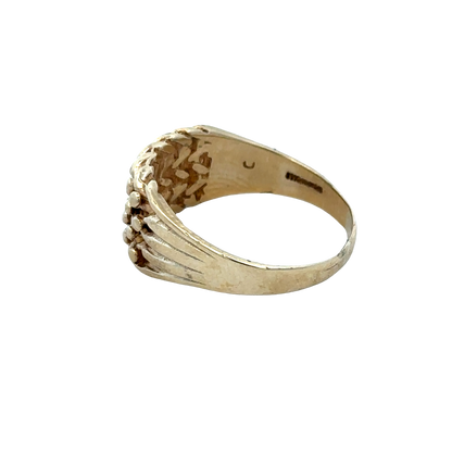 9ct yellow gold keeper ring size W1/2 with engraved design, crafted by Reeves and Sons, shown from a side angle.