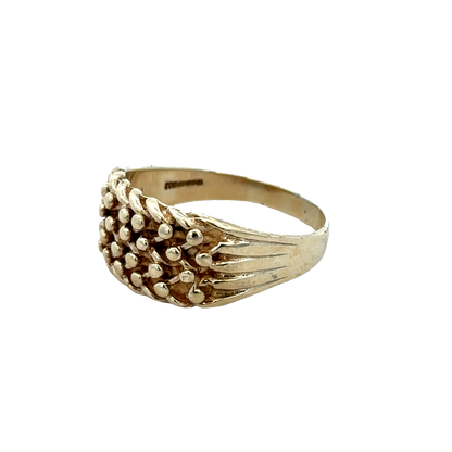 9ct yellow gold keeper ring in size W1/2 with engraved design, crafted by Reeves and Sons, shown close-up image.