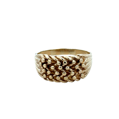 9ct yellow gold keeper ring size W1/2 by Reeves and Sons, detailed close-up showing polished gold finish and engraved hallmark.