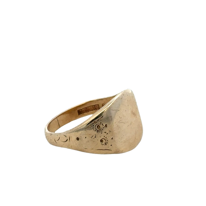 9ct yellow gold signet ring in size V with engraved face, crafted by Reeves and Sons, showcasing classic jewelry design.