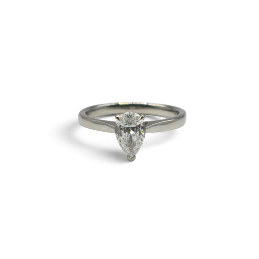 Diamond platinum ring by Reeves and Sons featuring a sparkling diamond set in a sleek platinum band.