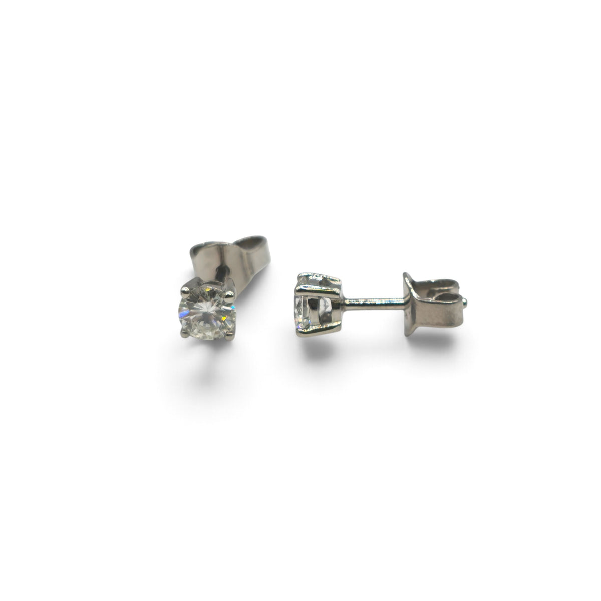 Reeves and Sons platinum diamond stud earrings featuring sparkling diamonds set in a classic earring design.