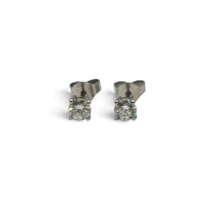 Reeves and Sons platinum diamond stud earrings featuring sparkling diamonds set in a classic design.