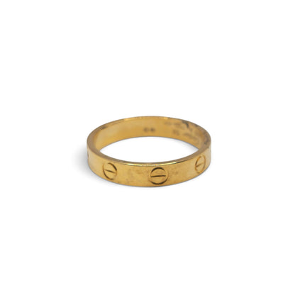 18ct yellow gold Cartier Love ring with screw motif, elegant jewelry piece, captured in Reeves and Sons image 20260921_101205.