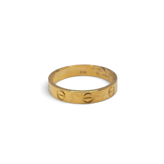 18ct yellow gold Cartier Love ring with screw motif, elegant jewelry piece, captured in Reeves and Sons image 20260921_101205.