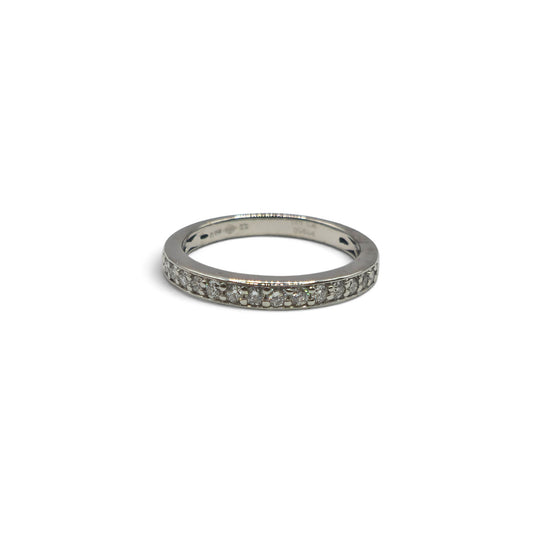 Reeves and Sons platinum half eternity diamond ring, showcasing a sleek band with sparkling diamonds around half of the circumference.