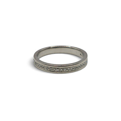 Platinum diamond half eternity ring by Reeves and Sons featuring a band with sparkling diamonds and intricate design.