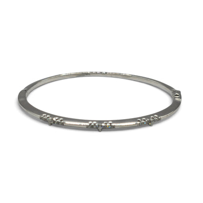 18ct white gold diamond bangle by Reeves and Sons, featuring sparkling diamonds and intricate design.