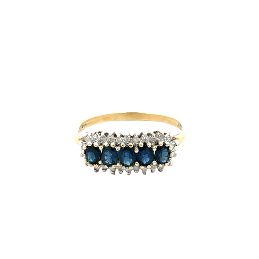 9ct yellow gold sapphire and diamond ring by Reeves and Sons, showcasing a central sapphire with surrounding diamonds.