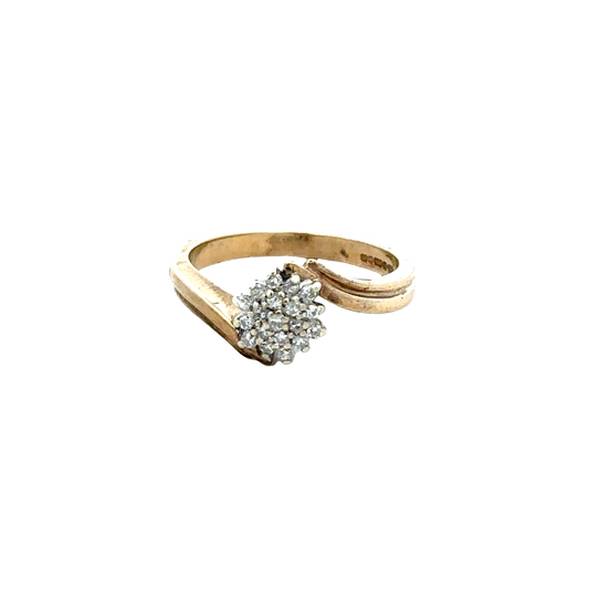 9ct yellow gold diamond ring by Reeves and Sons with sparkling diamonds, showing intricate design and polished finish.