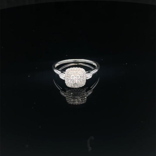 9ct white gold diamond cluster ring by Reeves and Sons, featuring a sparkling diamond cluster design.