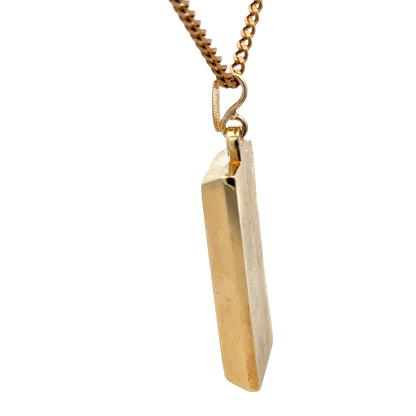 9ct yellow gold ingot pendant weighing 34.2g, Reeves and Sons jewelry with detailed gold ingot design and polished finish.